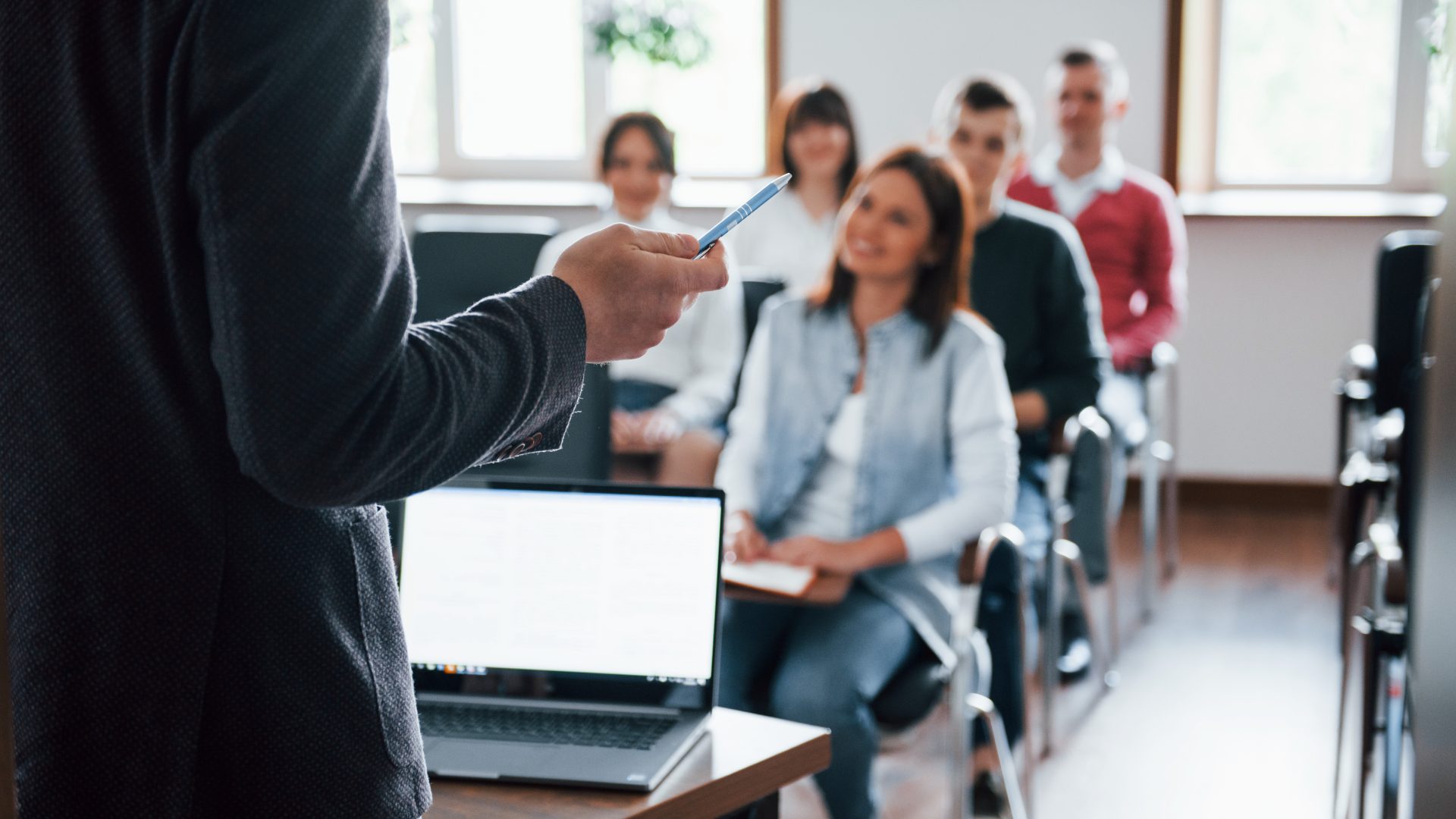 everyone-is-smiling-listens-group-people-business-conference-modern-classroom-daytime